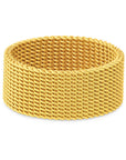 Gold woven bracelet on a white background