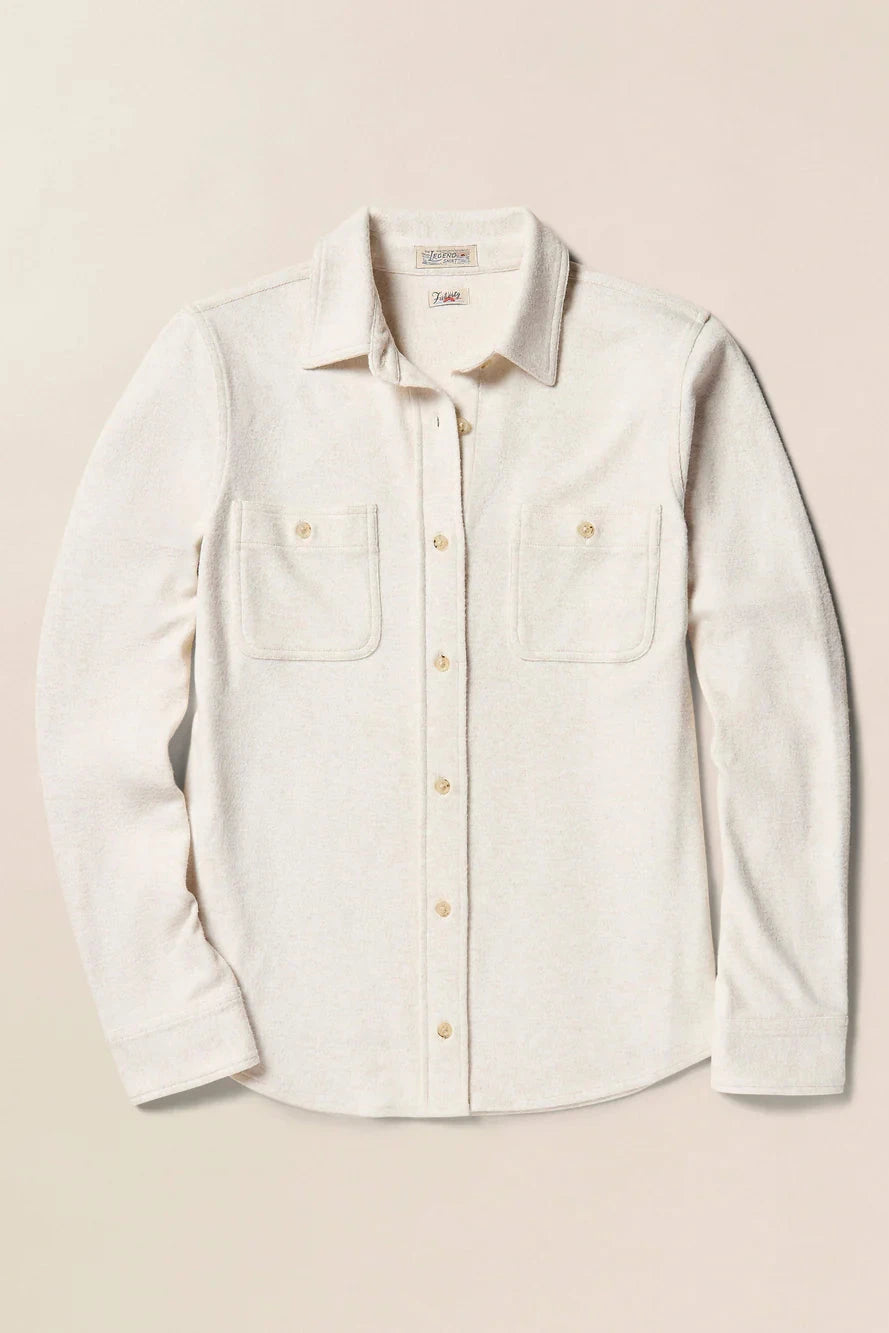 Light-colored shirt with button details on a beige background