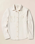 Light-colored shirt with button details on a beige background