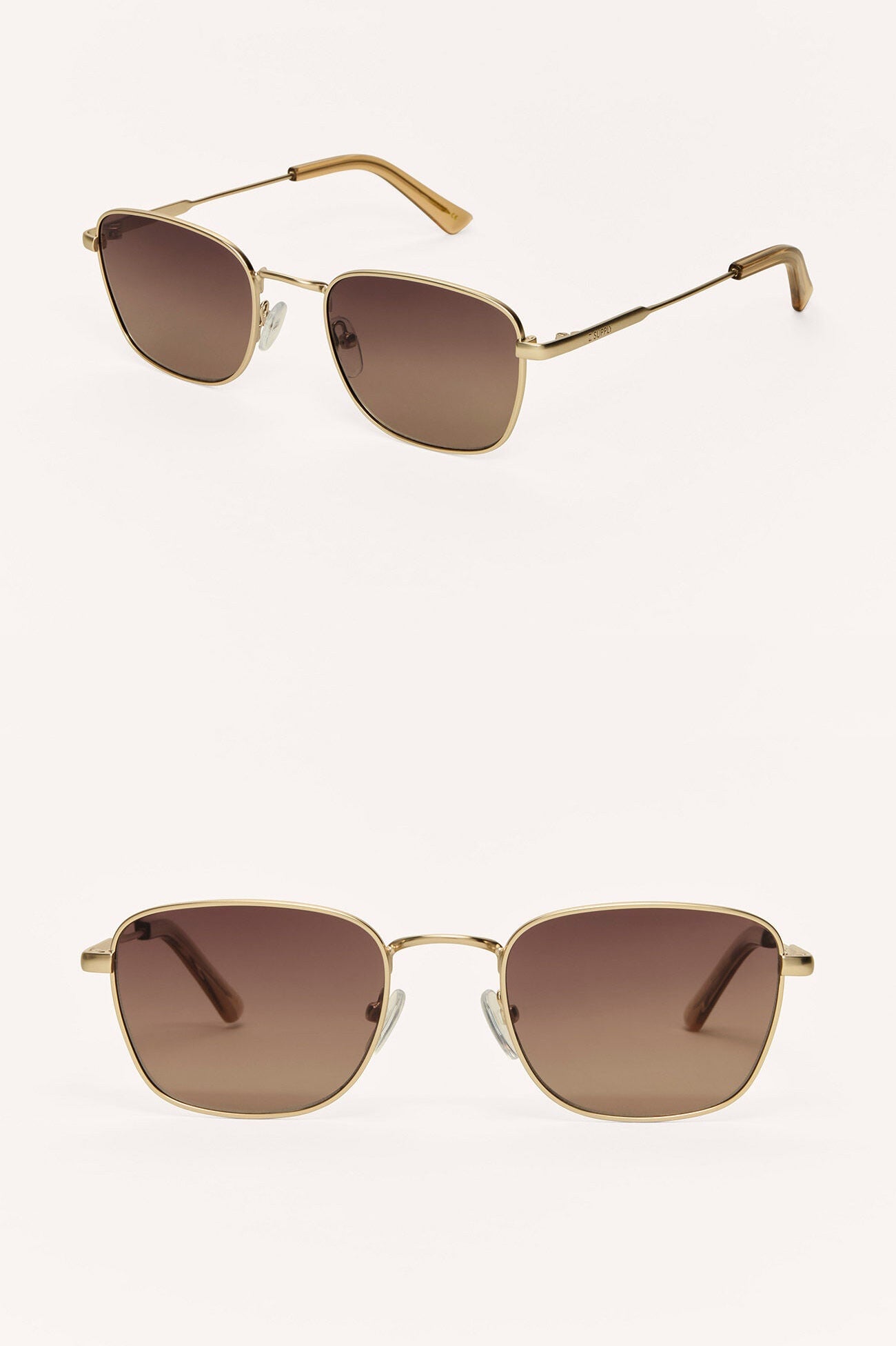 Gold-framed sunglasses with brown lenses on a white background