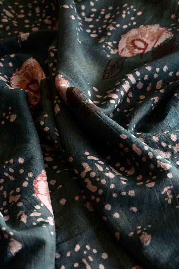 Dark green fabric with pink floral patterns