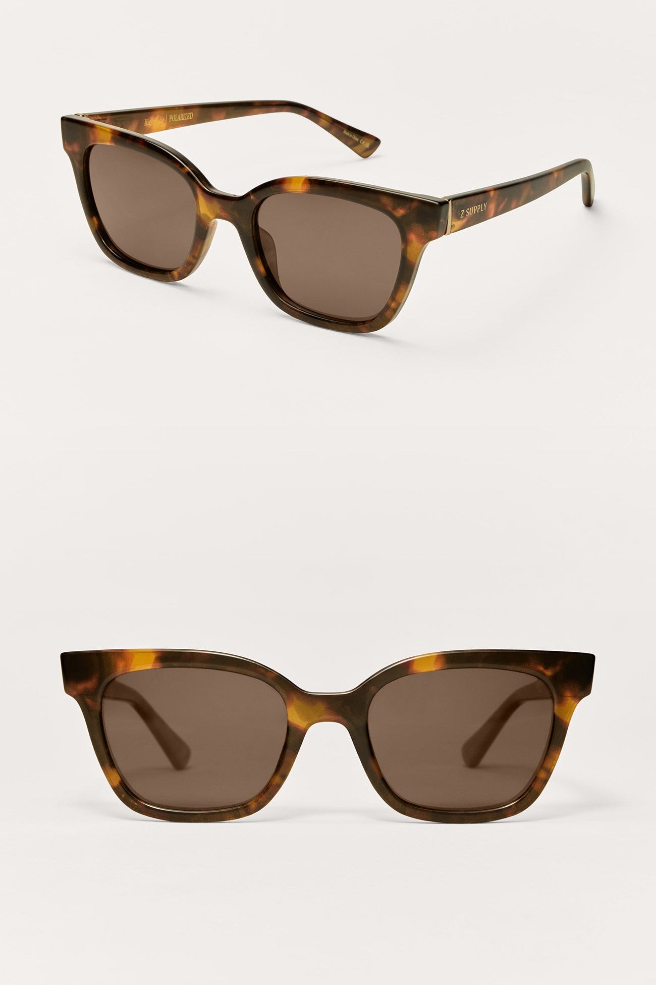 Tortoiseshell sunglasses with brown lenses on a white background