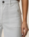 Light gray pants with a button detail on a neutral background