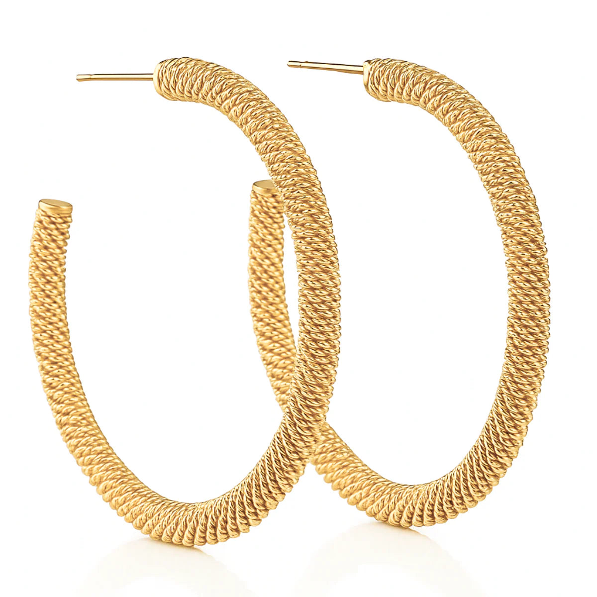 Gold hoop earrings on a white background