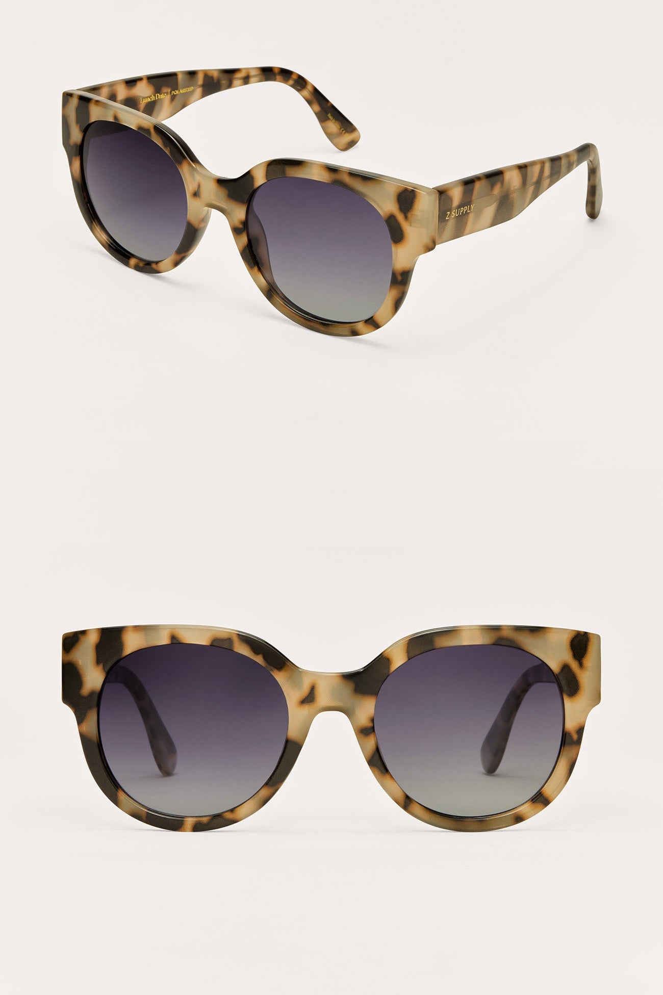 Pair of tortoiseshell sunglasses with gradient lenses on a light gray background