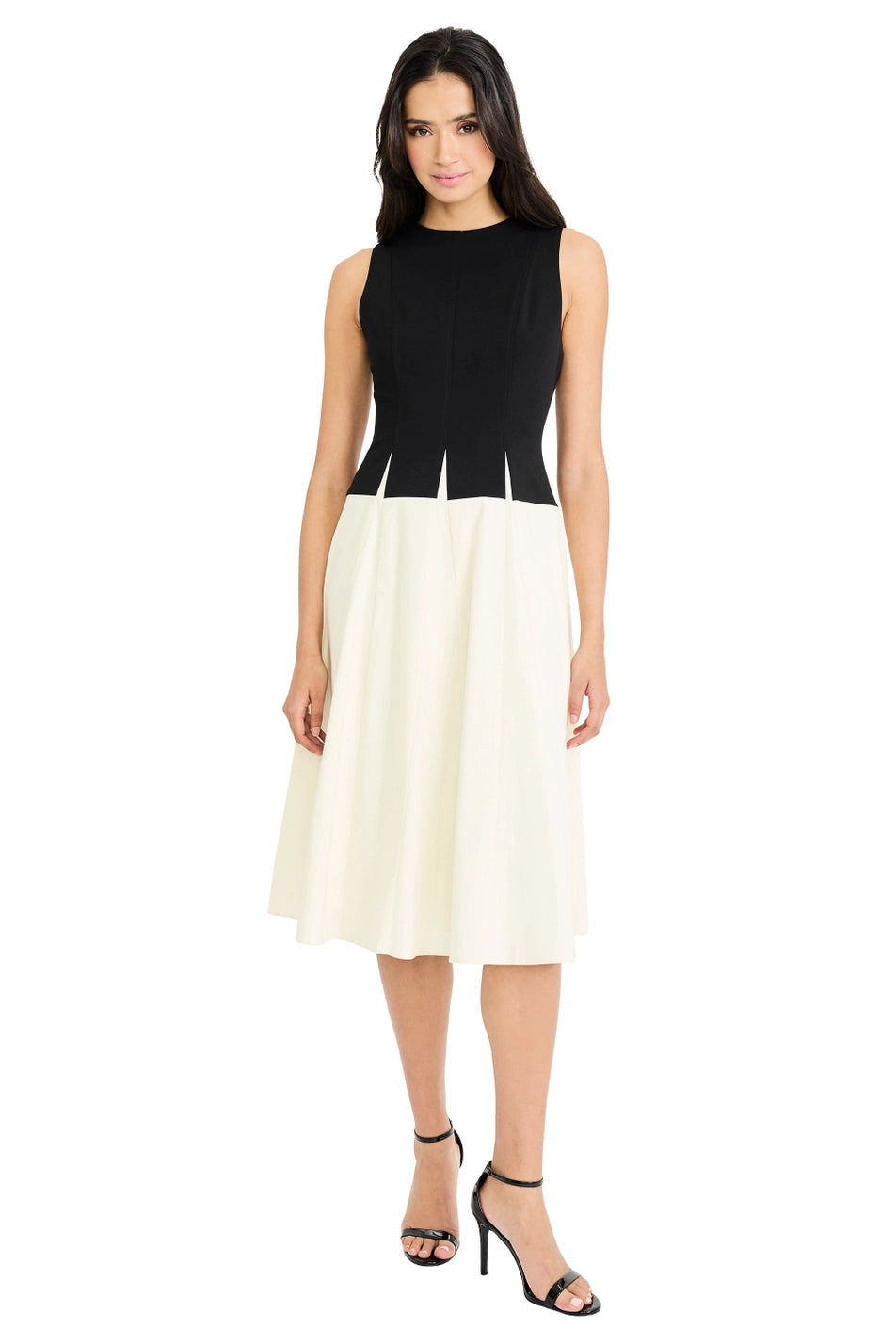 Woman wearing a black and white dress on a white background