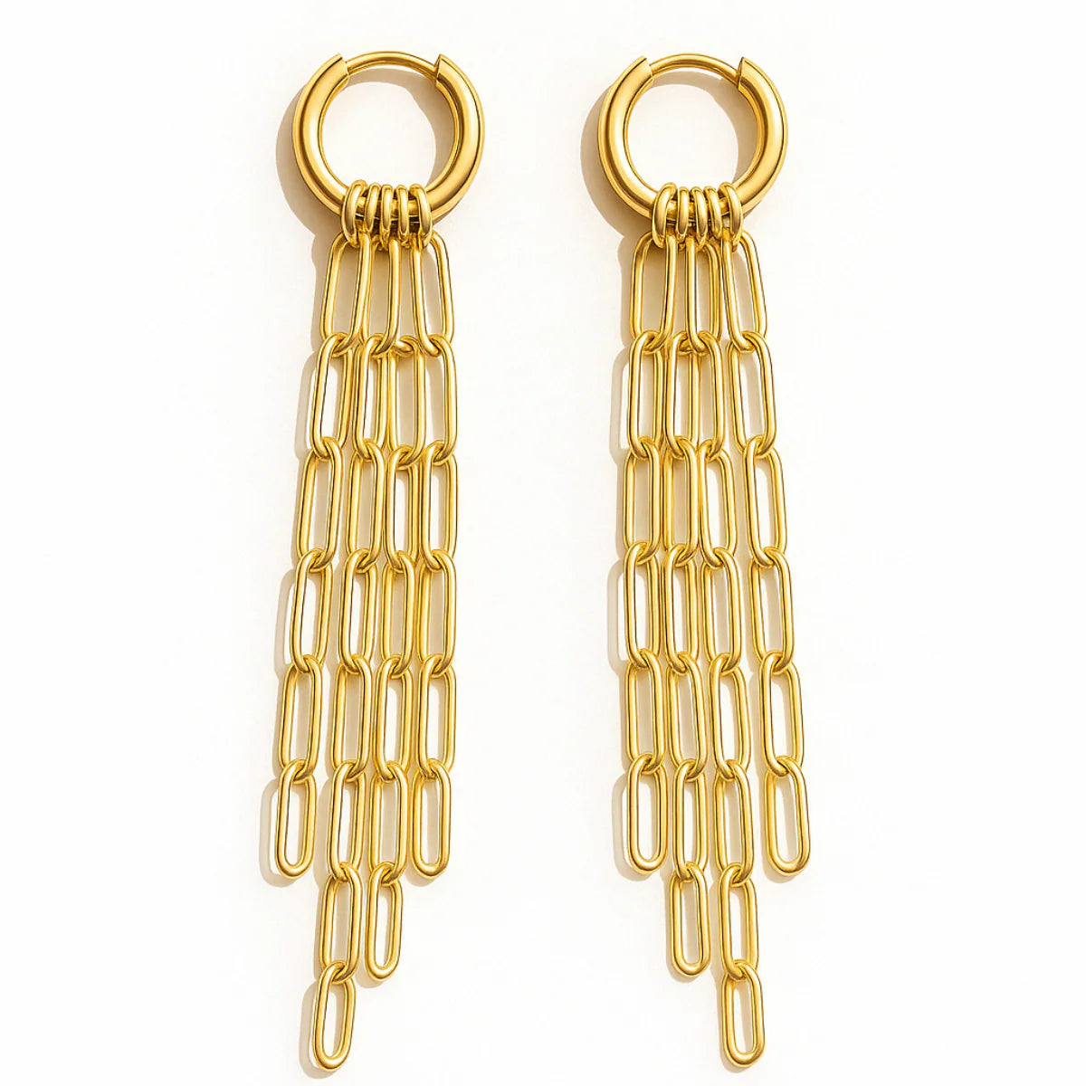 Gold chain earrings on a white background