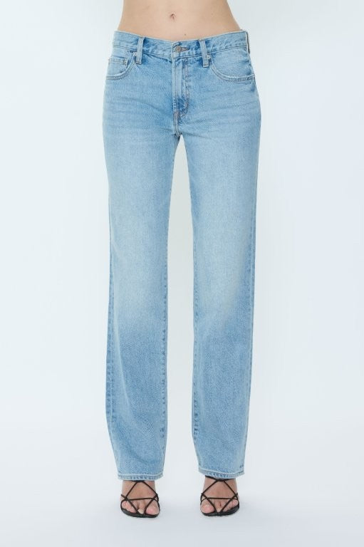 Light blue jeans worn by a person on a white background