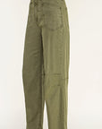 Olive green wide-leg cropped pants shown on a mannequin lower body with dark brown pointed-toe slingback heels against a plain light background.