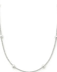 Silver necklace with small beads on a white background