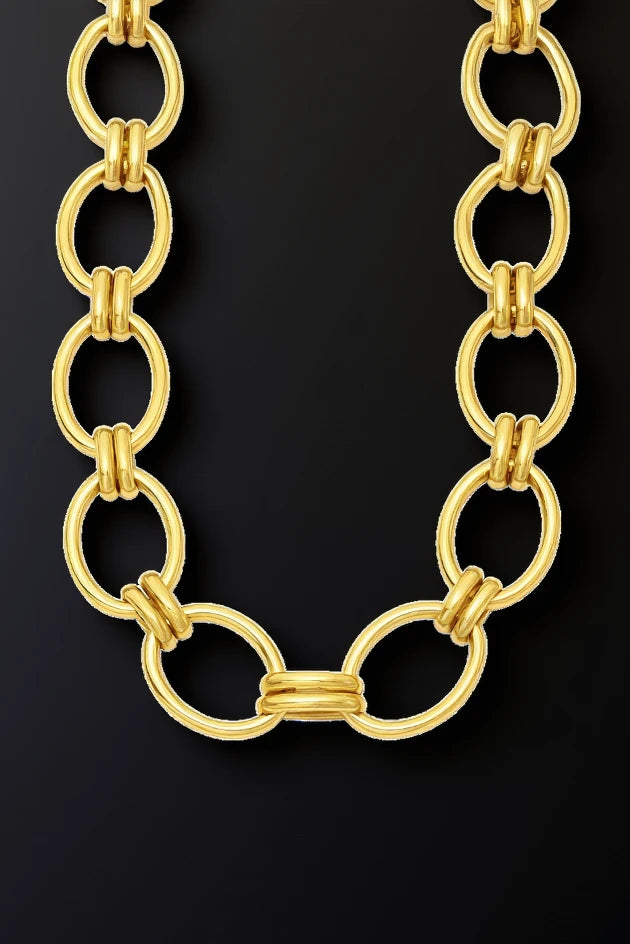 Gold chain necklace on a white background