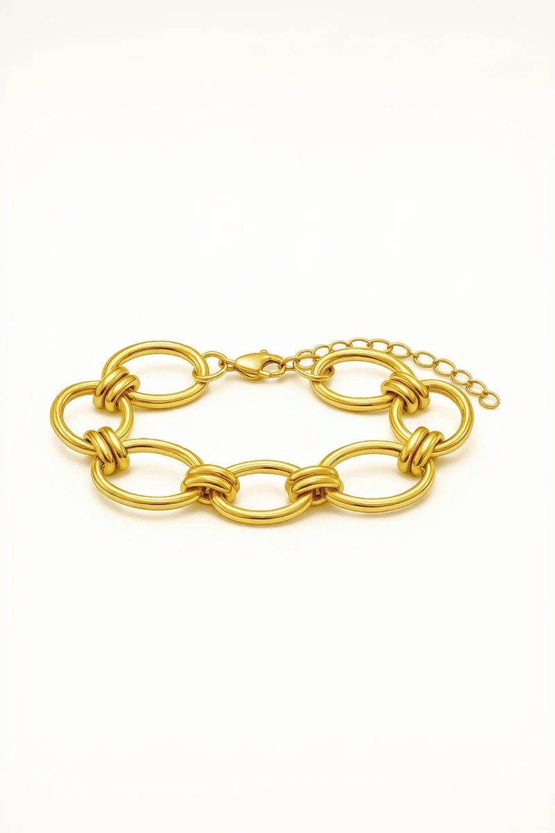 Gold chain bracelet on a white background