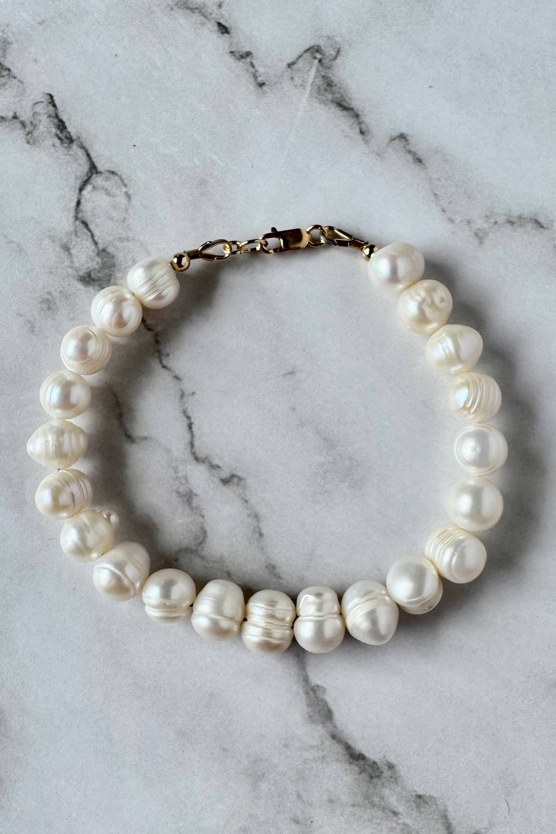 Pearl necklace on a marble surface