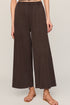 Brown wide-leg pants worn by a person on a plain background