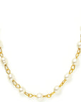 Pearl necklace with gold chain on a white background