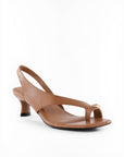 Brown sandal with a thin strap on a white background