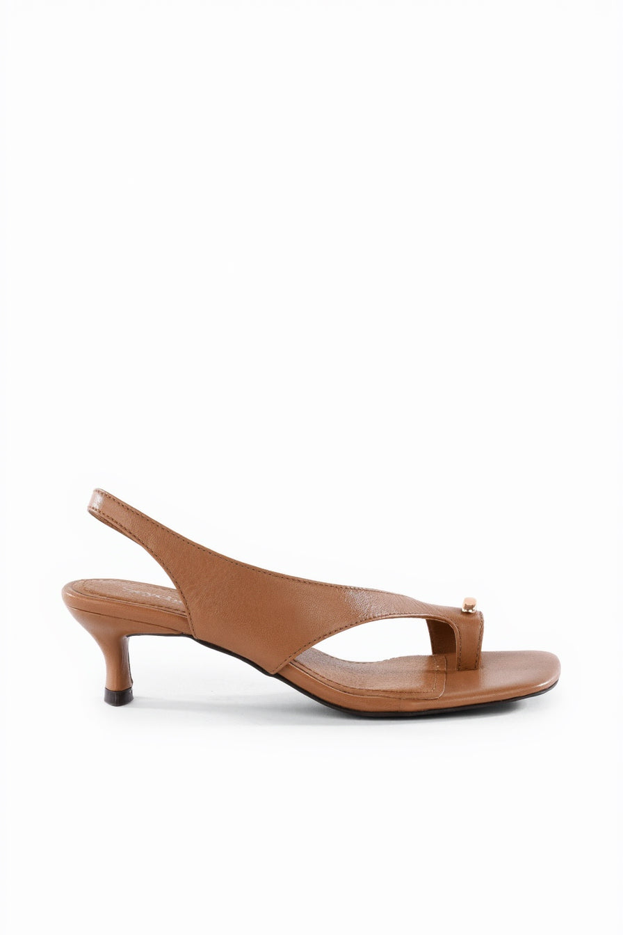 Brown sandal with a high heel on a white background
