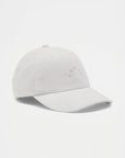 White baseball cap on a light gray background