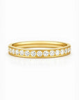 Gold ring with diamonds on a white background