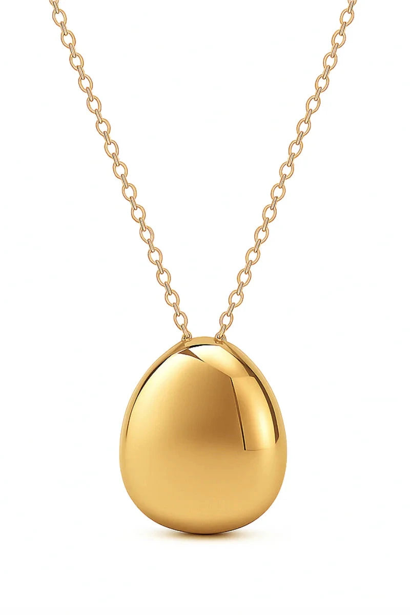 Gold pendant necklace on a white background