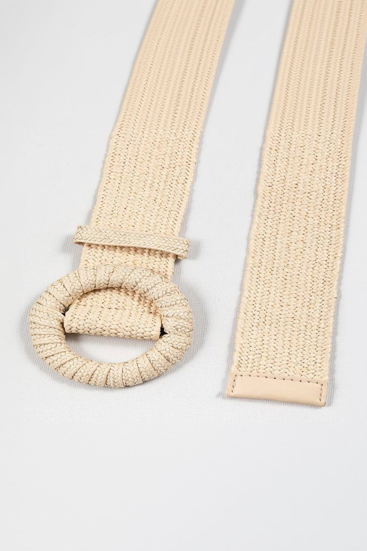 Beige woven belt with a round buckle on a light gray background