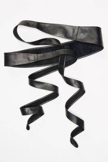 Black leather belt with a decorative buckle on a white background