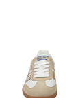 Beige and white sneaker with 'Puma' branding on a white background