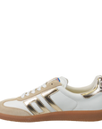 White and beige sneaker with brown sole on a white background