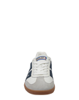 Navy and white sneaker with a visible brand logo on a white background