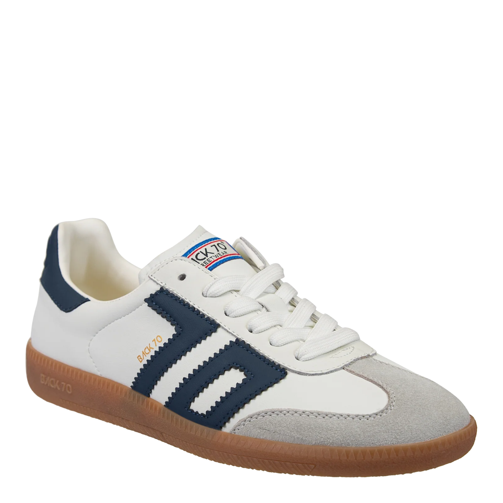 White and navy sneaker with brown sole on a white background