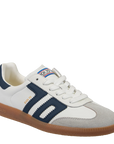 White and navy sneaker with brown sole on a white background