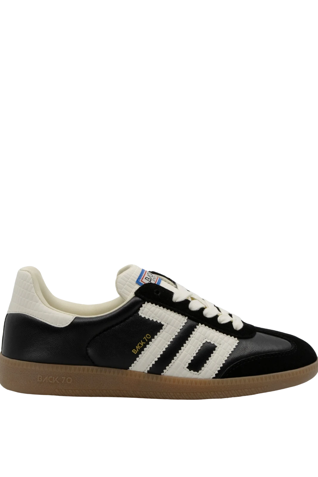 A low-top Adidas Samba sneaker in black and off-white leather with a gum sole, shown from a side profile on a white background.