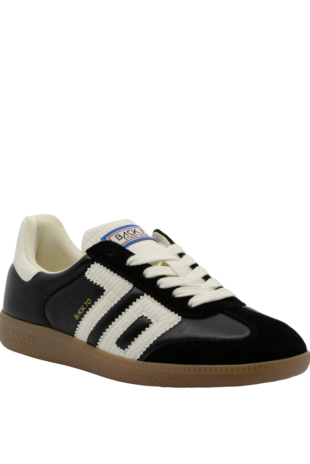Black and white sneaker with visible branding on a white background