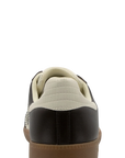 Sneaker with a black and beige design on a white background