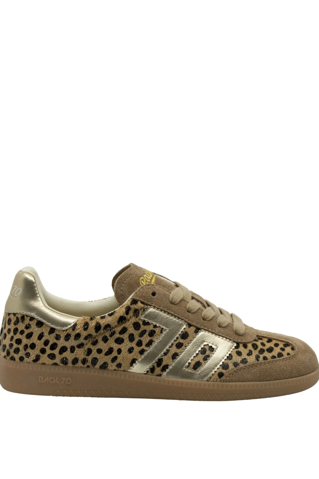 A low-top sneaker featuring a beige and black leopard print pattern on the side panels, with metallic gold suede overlays and a gum brown sole, shown against a plain white background.
