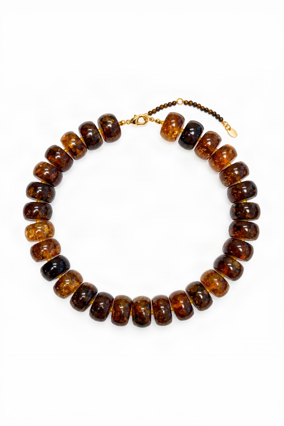 A beaded necklace made of polished amber-brown disc beads with a small gold clasp and extender chain, photographed on a clean white background.