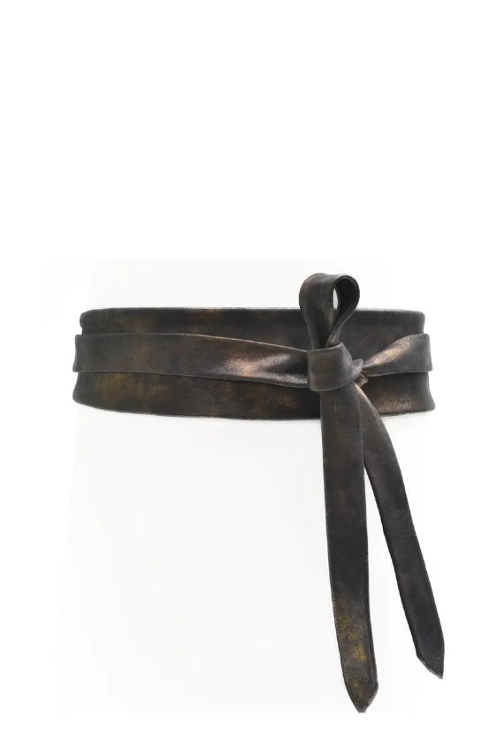 Bronze-colored leather belt with a bow on a white background