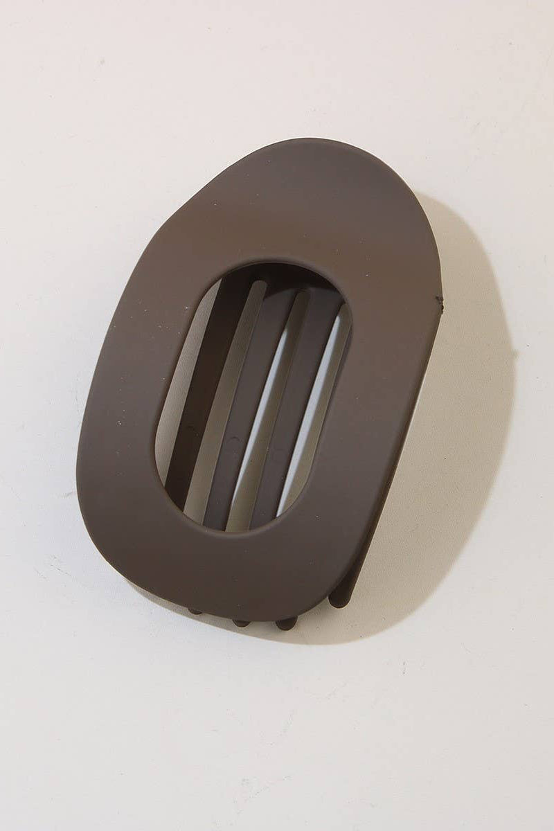 Brown plastic clip on a white background