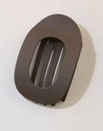 Brown plastic clip on a white background