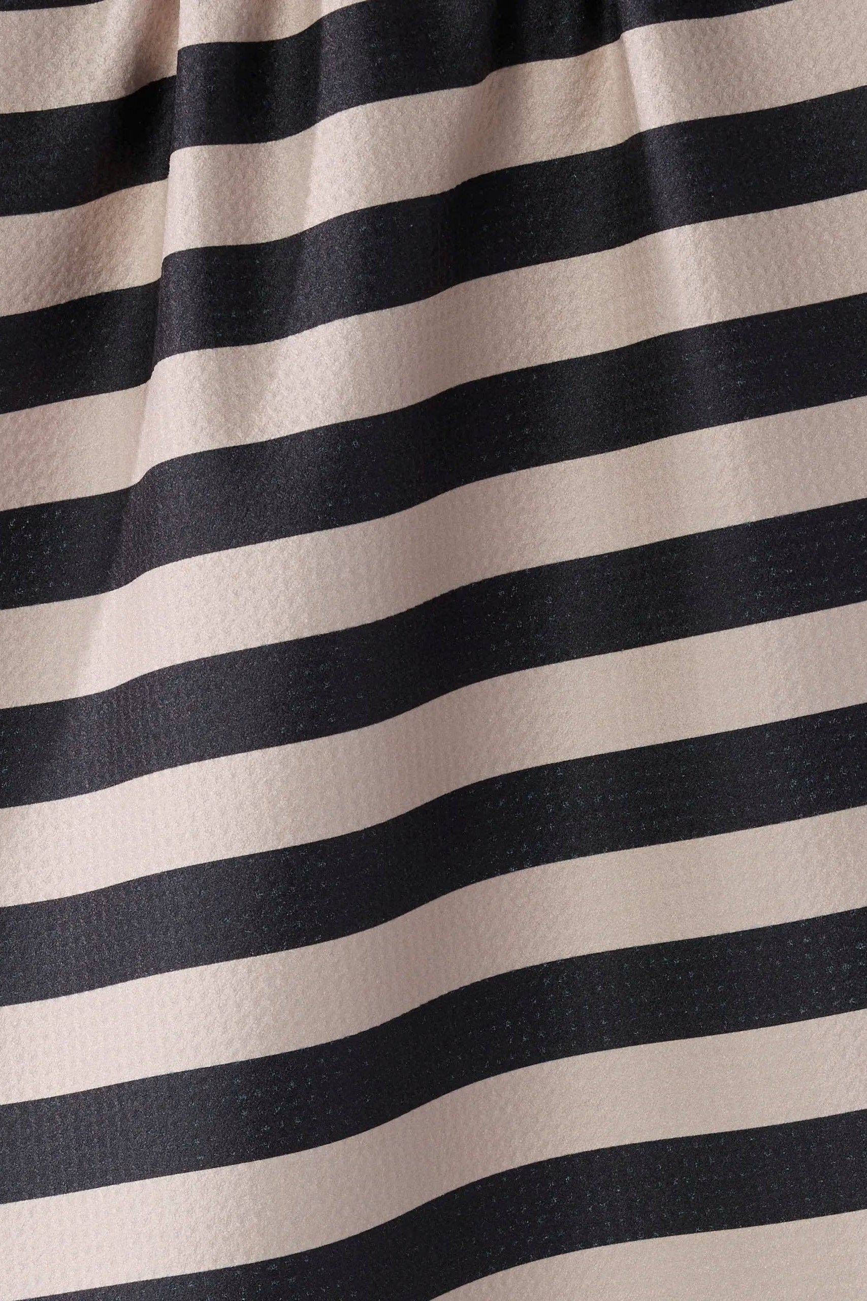 Close-up of black and beige striped fabric