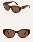 Tortoiseshell sunglasses with brown lenses on a white background