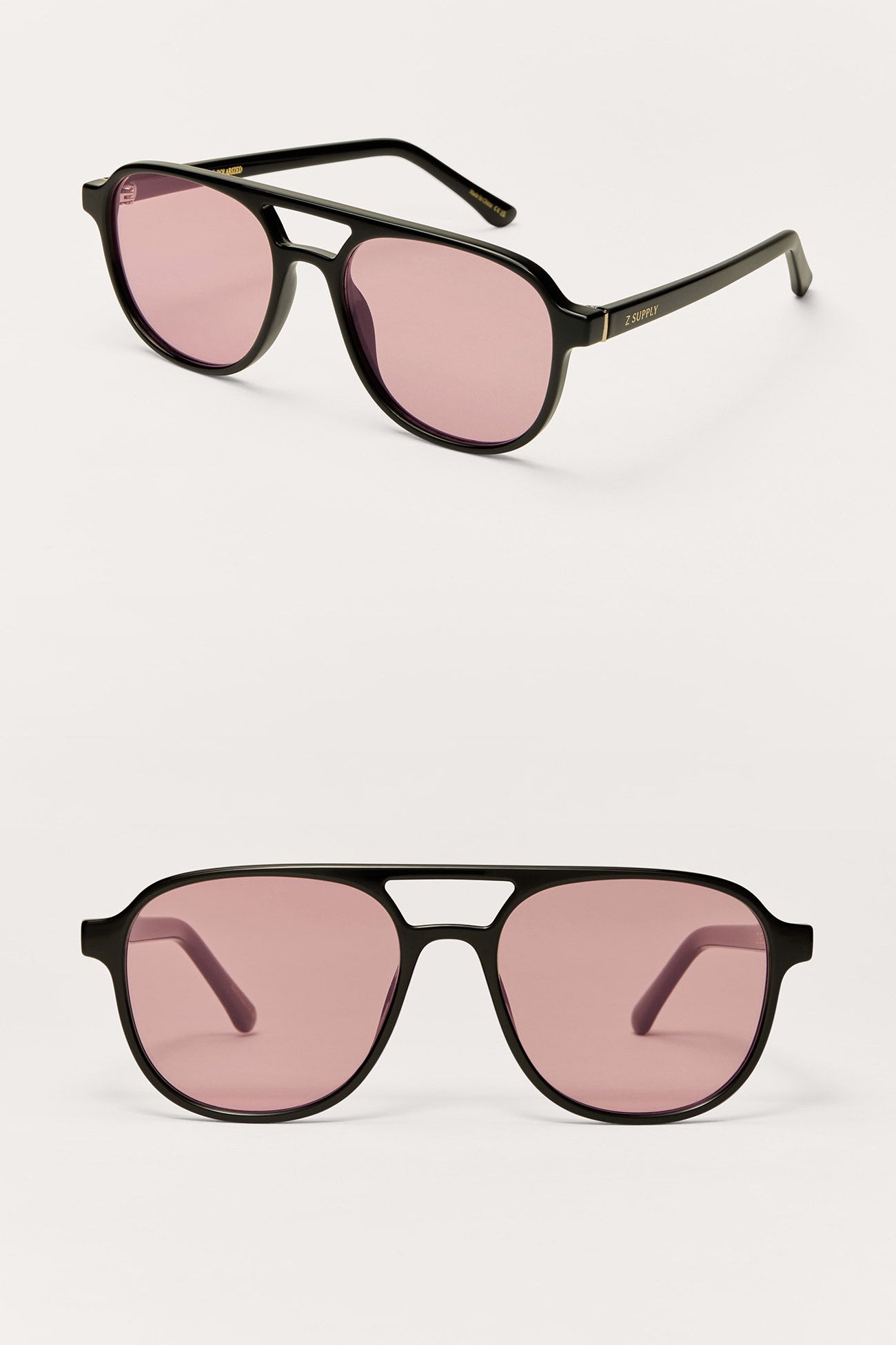 Two pairs of sunglasses with pink lenses on a white background