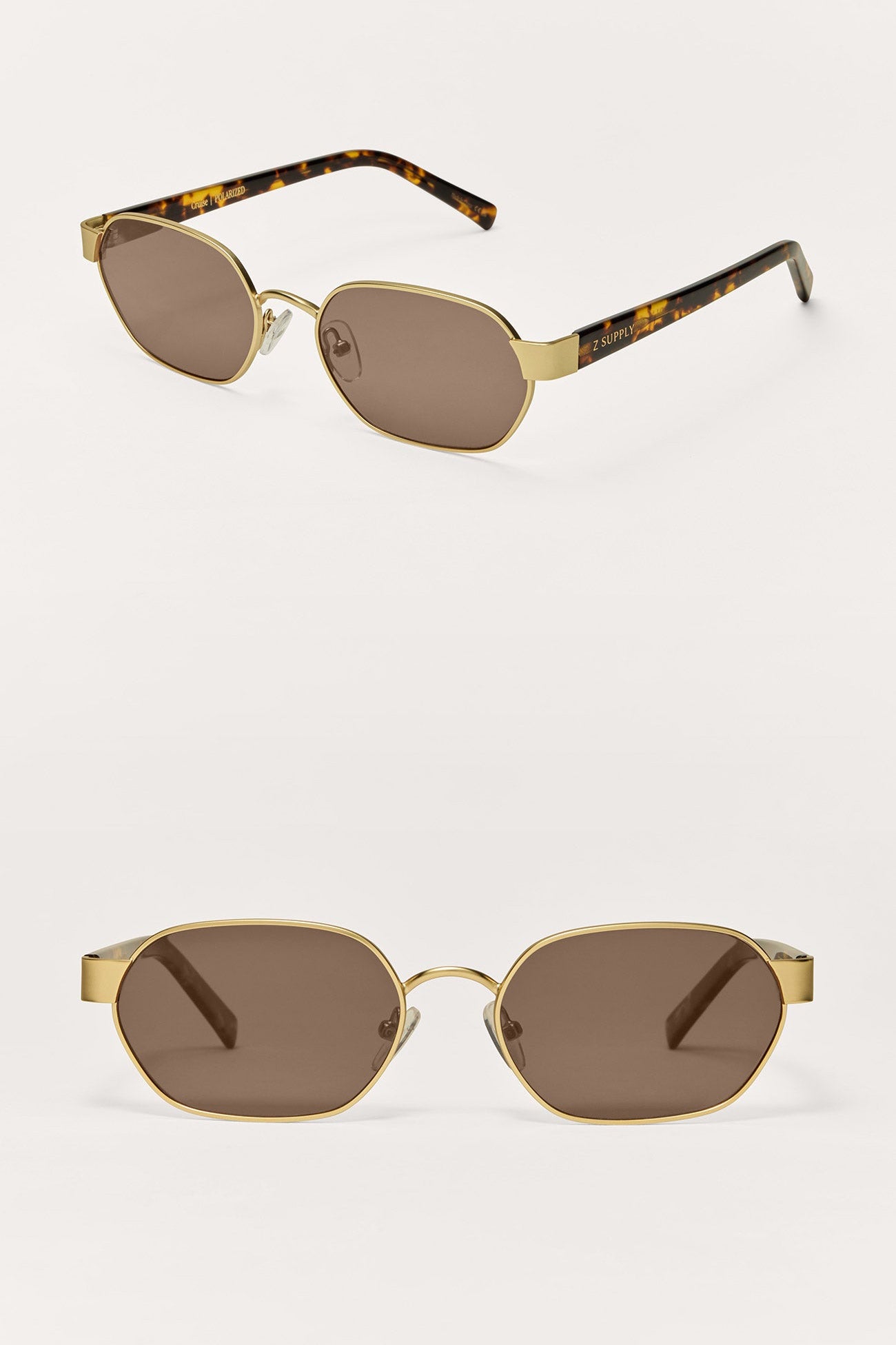 Two pairs of sunglasses with gold frames and brown lenses on a white background.