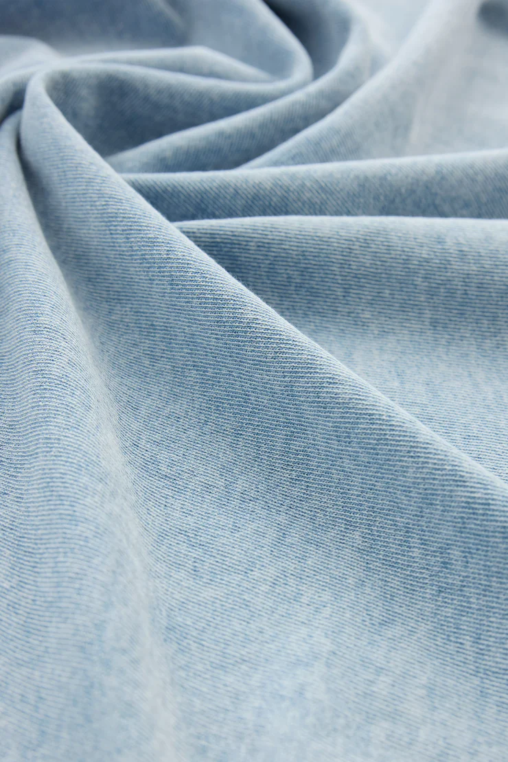 Close-up of light blue fabric with a soft texture