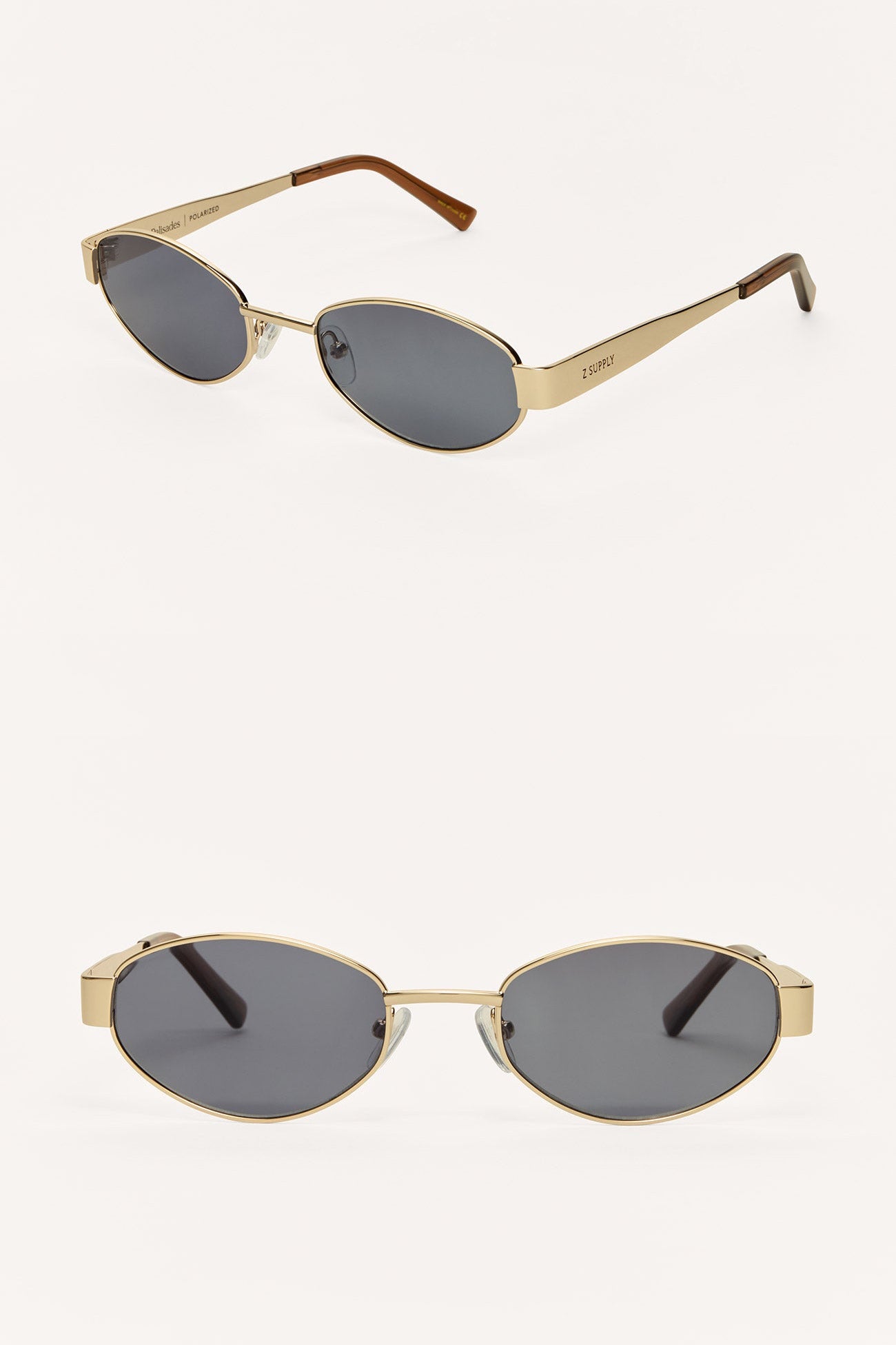 Gold-framed sunglasses with dark lenses on a white background