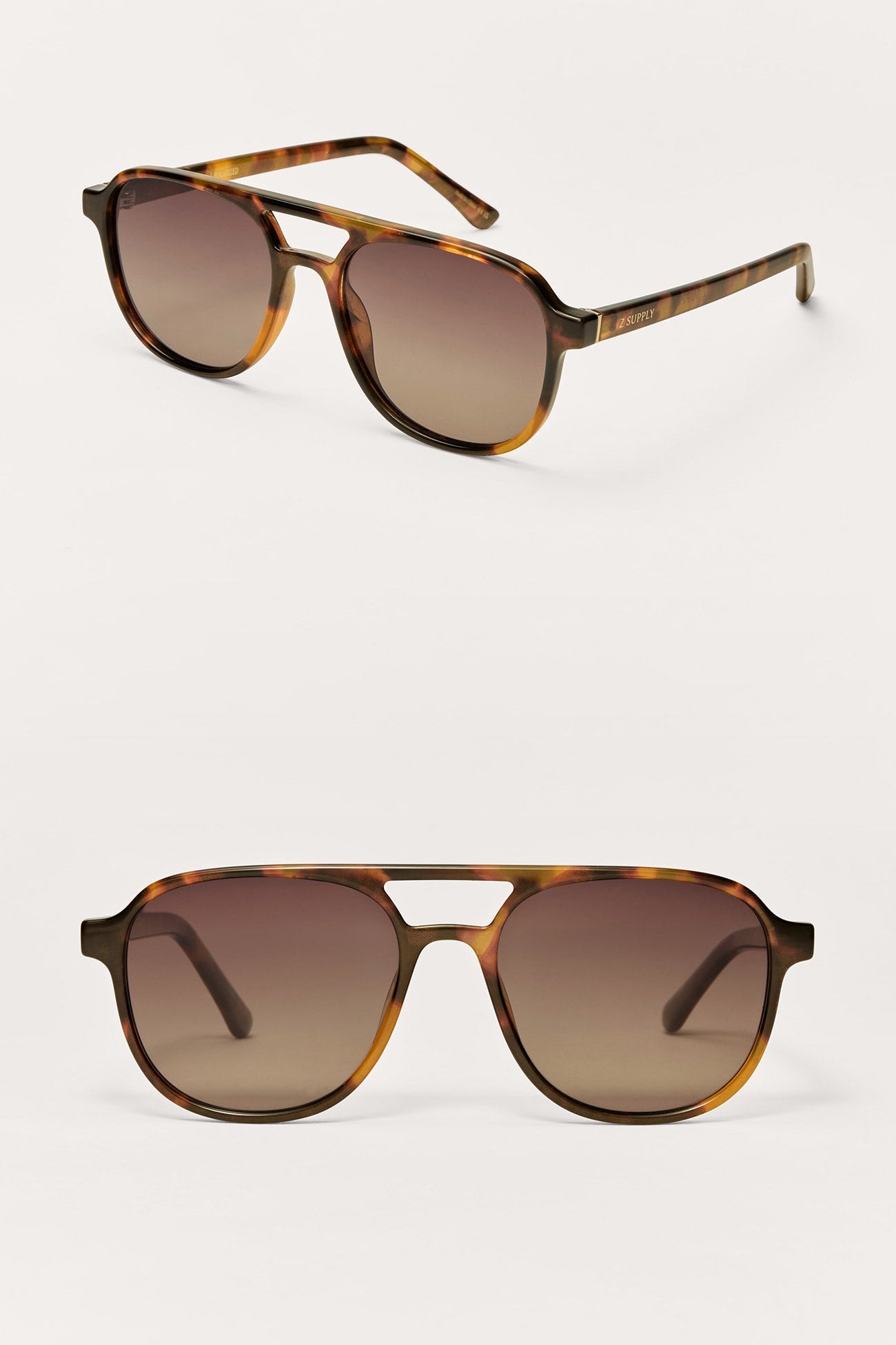 Pair of tortoiseshell sunglasses with brown gradient lenses on a white background