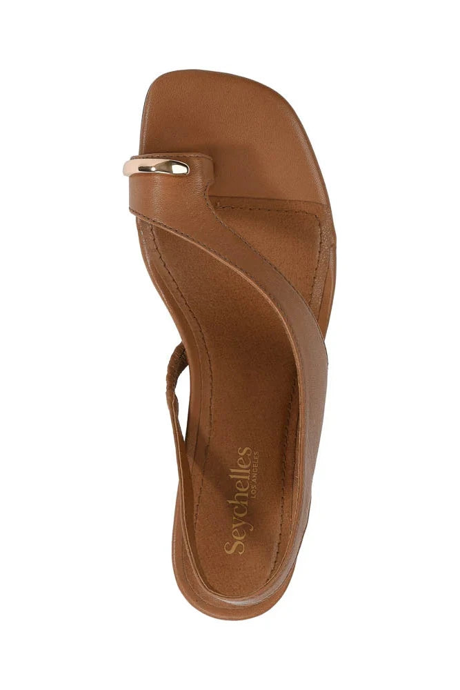 Brown sandal with a strap on a white background