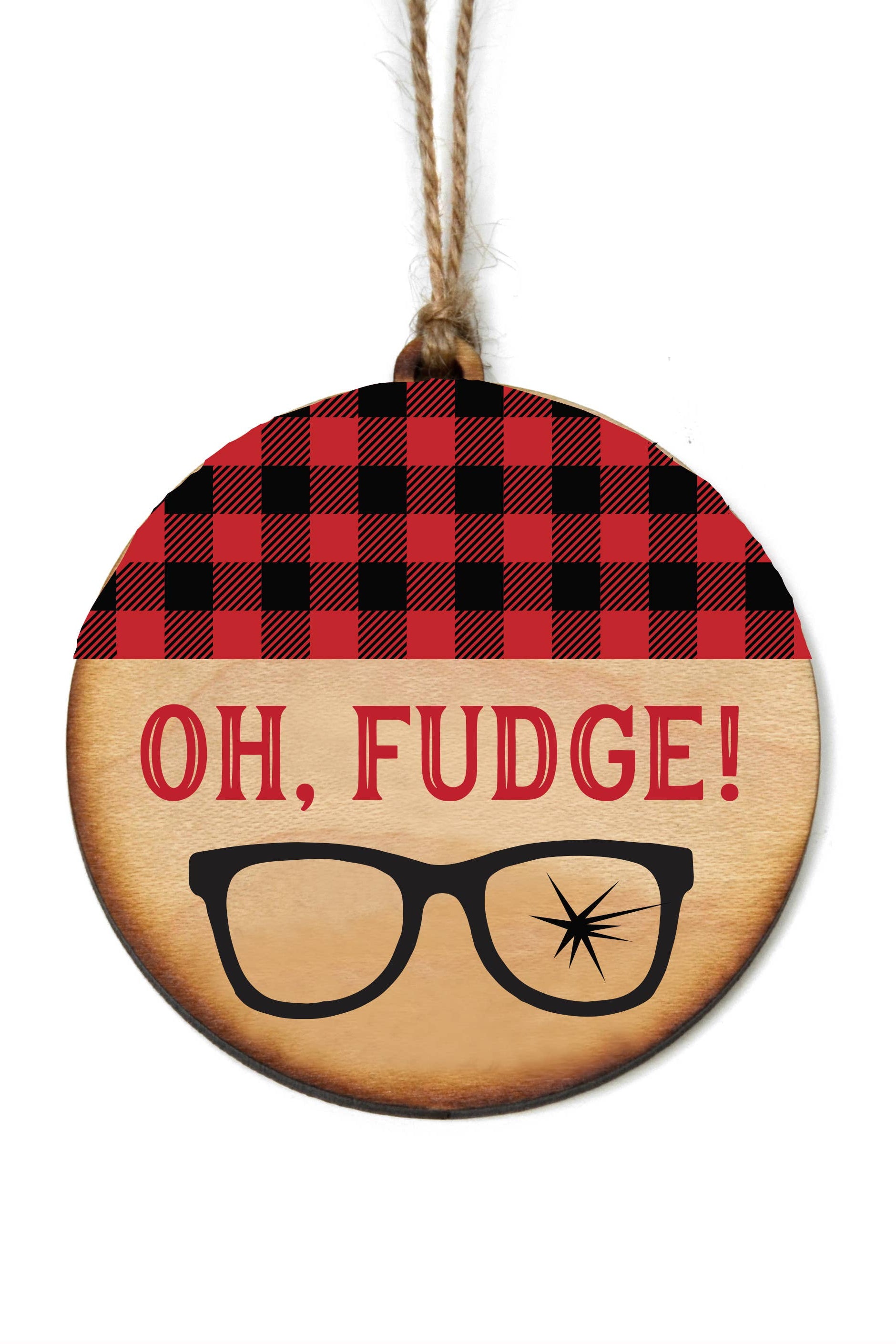 A round wooden holiday ornament with 'OH, FUDGE!' printed in capital letters, accompanied by an illustration of a glasses with a star on one lens, against a red and black checkered background.